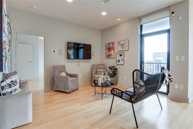 301 NE 4th St Unit 10, Oklahoma City, OK 73104 - living area with light wood-style floors, baseboards, and recessed lighting
