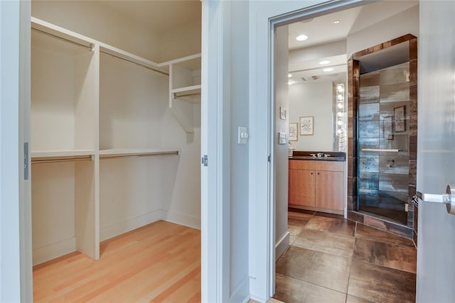 301 NE 4th St Unit 10, Oklahoma City, OK 73104 - walk in closet featuring a sink