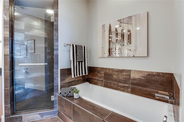 301 NE 4th St Unit 10, Oklahoma City, OK 73104 - full bath featuring a stall shower and a bath