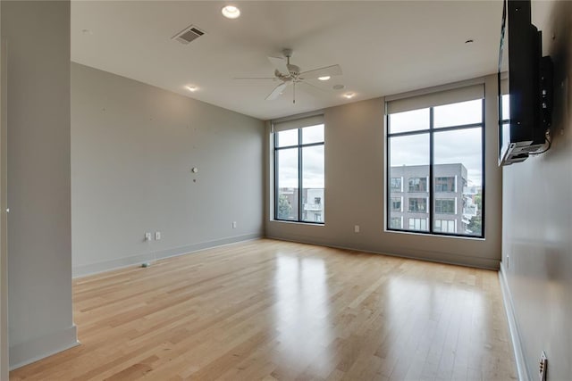 301 NE 4th St Unit 10, Oklahoma City, OK 73104 - spare room with ceiling fan, light wood-style flooring, baseboards, and recessed lighting