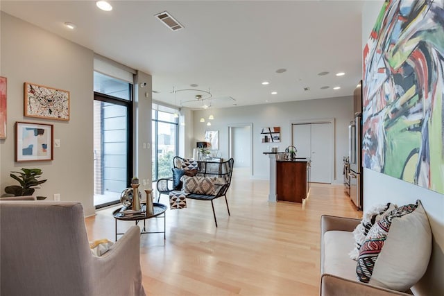 301 NE 4th St Unit 10, Oklahoma City, OK 73104 - living area featuring light wood-type flooring and recessed lighting