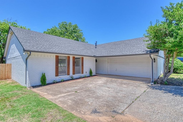 2804 Meadow Ave, Norman, OK 73072 - ranch-style home with a garage, a shingled roof, brick siding, and concrete driveway
