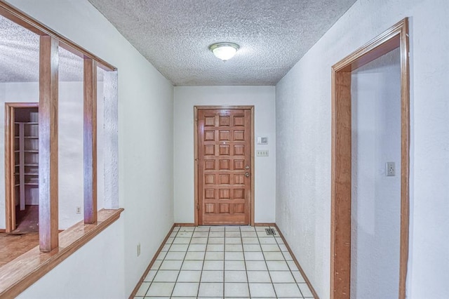 2804 Meadow Ave, Norman, OK 73072 - entryway with a textured ceiling and light tile patterned flooring