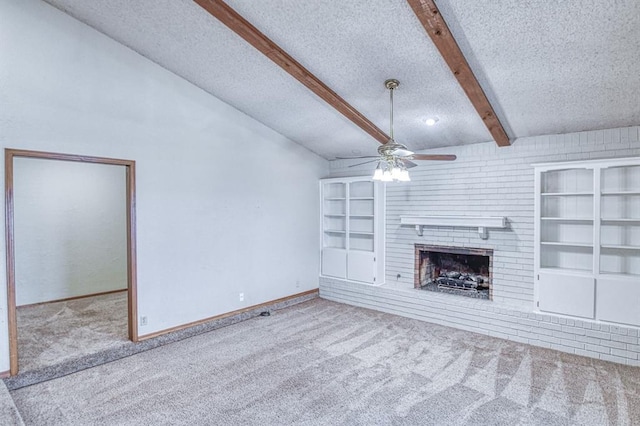 2804 Meadow Ave, Norman, OK 73072 - unfurnished living room featuring a textured ceiling, a ceiling fan, carpet, beam ceiling, and built in features