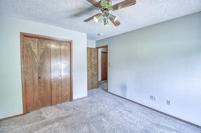 2804 Meadow Ave, Norman, OK 73072 - unfurnished bedroom with carpet flooring, a closet, a textured ceiling, ceiling fan, and baseboards
