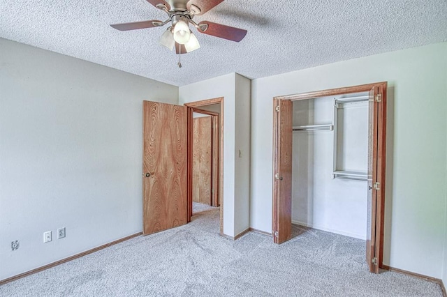 2804 Meadow Ave, Norman, OK 73072 - unfurnished bedroom featuring carpet, a textured ceiling, a closet, and ceiling fan