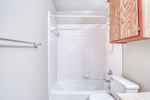 2804 Meadow Ave, Norman, OK 73072 - bathroom featuring toilet, bathtub / shower combination, a textured ceiling, and vanity