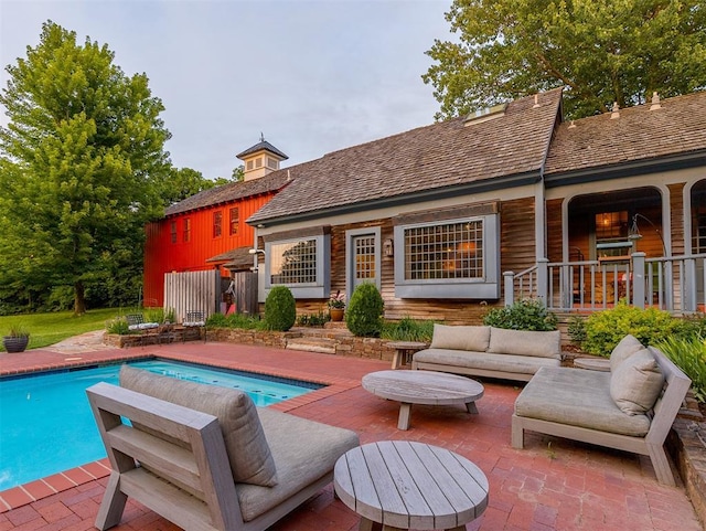 4005 NE 122nd St, Edmond, OK 73013 - swimming pool with a patio area and an outdoor living space