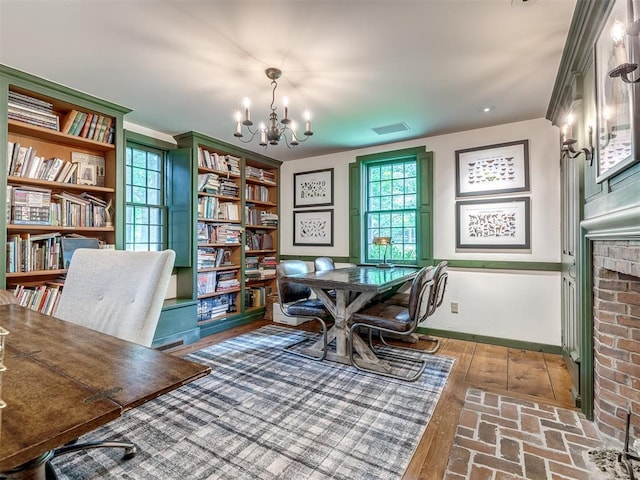 4005 NE 122nd St, Edmond, OK 73013 - office area featuring a chandelier and a brick fireplace