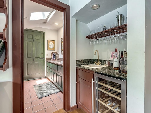 4005 NE 122nd St, Edmond, OK 73013 - indoor wet bar featuring beverage cooler, lofted ceiling, and light tile patterned flooring