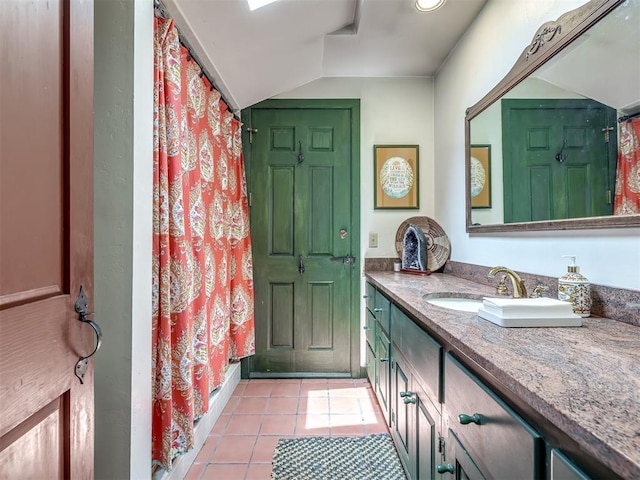 4005 NE 122nd St, Edmond, OK 73013 - bathroom with vanity, tile patterned flooring, lofted ceiling, and a shower with shower curtain