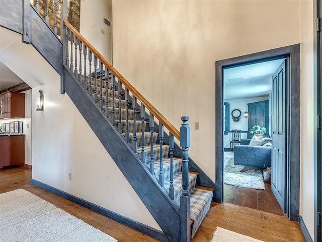4005 NE 122nd St, Edmond, OK 73013 - stairs featuring wood finished floors and a towering ceiling