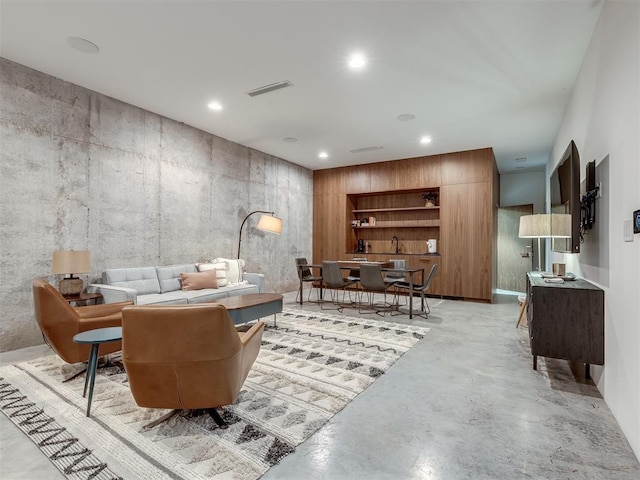 4005 NE 122nd St, Edmond, OK 73013 - sitting room featuring concrete floors and recessed lighting
