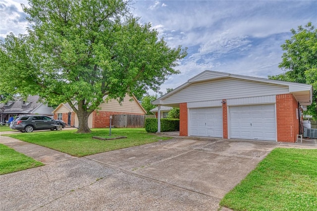 342 W Birch Dr, Mustang, OK 73064 - garage featuring driveway