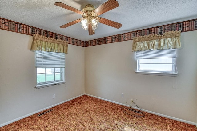 342 W Birch Dr, Mustang, OK 73064 - spare room with plenty of natural light, carpet floors, ceiling fan, and a textured ceiling
