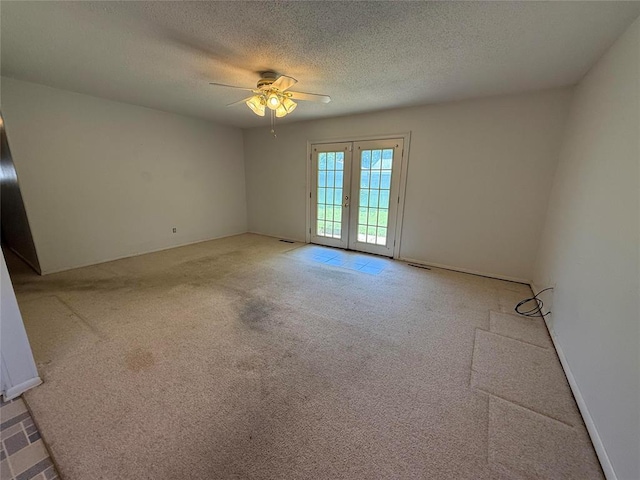 342 W Birch Dr, Mustang, OK 73064 - carpeted empty room featuring ceiling fan, french doors, and a textured ceiling
