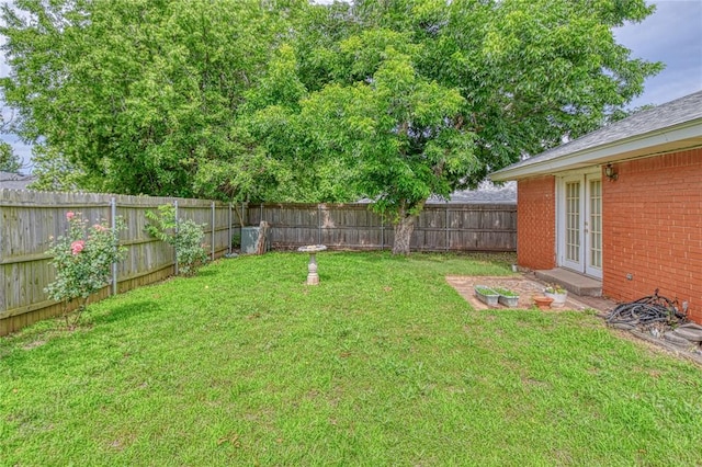 342 W Birch Dr, Mustang, OK 73064 - fenced backyard featuring french doors