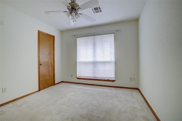913 Elm Creek Dr, Moore, OK 73160 - spare room featuring light colored carpet, ceiling fan, and baseboards