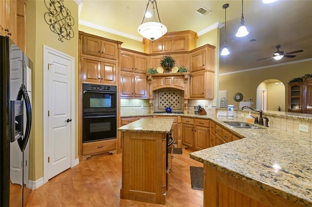 262 Shrouder Rd, Broken Bow, OK 74728 - kitchen featuring refrigerator with ice dispenser, a sink, crown molding, gas cooktop, and backsplash