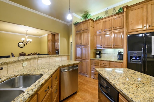 262 Shrouder Rd, Broken Bow, OK 74728 - kitchen with dishwasher, black fridge, a sink, decorative backsplash, and pendant lighting
