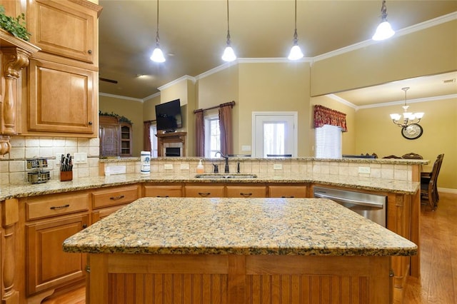 262 Shrouder Rd, Broken Bow, OK 74728 - kitchen with a sink, light wood-type flooring, stainless steel dishwasher, backsplash, and a center island