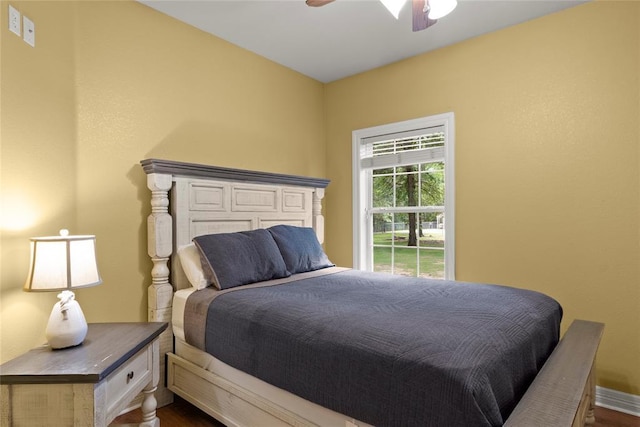 262 Shrouder Rd, Broken Bow, OK 74728 - bedroom featuring dark wood-style flooring, baseboards, and ceiling fan