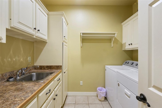 262 Shrouder Rd, Broken Bow, OK 74728 - laundry area featuring washing machine and dryer, cabinet space, baseboards, and light tile patterned floors