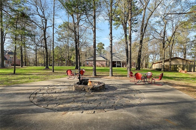 262 Shrouder Rd, Broken Bow, OK 74728 - view of community featuring an outdoor fire pit and a yard