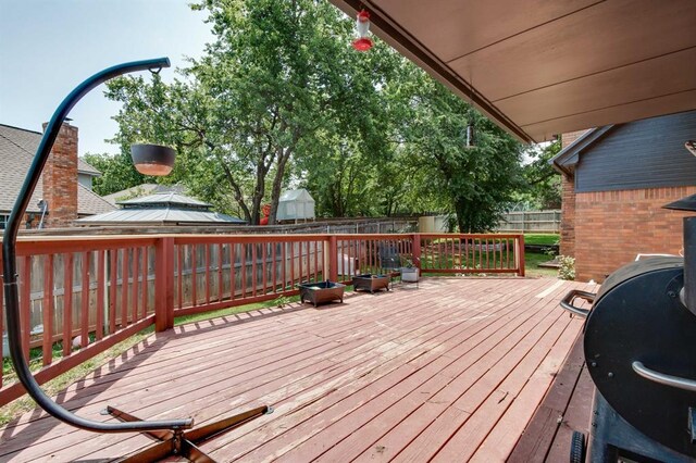 1408 Carlton, Edmond, OK 73034 - deck featuring a fenced backyard
