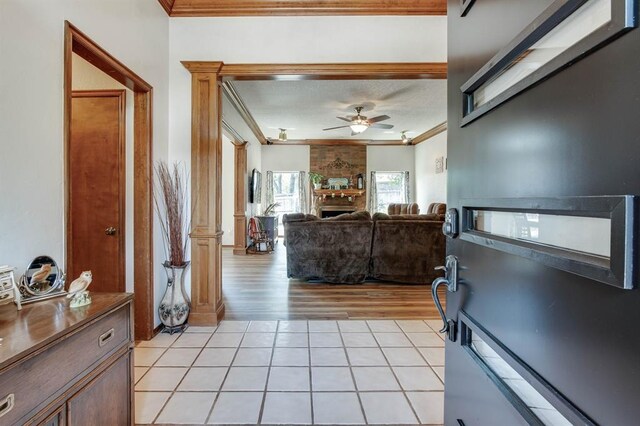 1408 Carlton, Edmond, OK 73034 - foyer entrance featuring ornamental molding, ceiling fan, and light tile patterned flooring