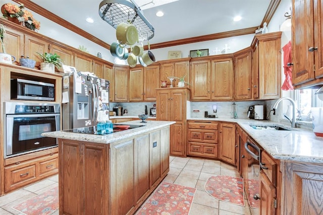 1408 Carlton, Edmond, OK 73034 - kitchen with appliances with stainless steel finishes, a sink, ornamental molding, backsplash, and a kitchen island