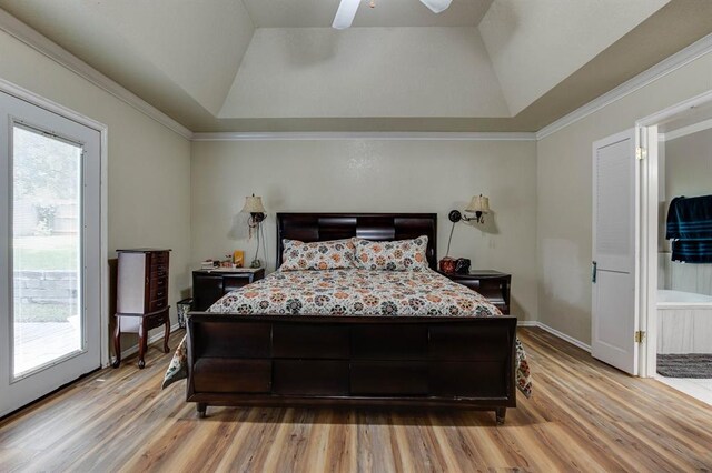 1408 Carlton, Edmond, OK 73034 - bedroom featuring a tray ceiling, light wood-type flooring, lofted ceiling, a ceiling fan, and ensuite bath
