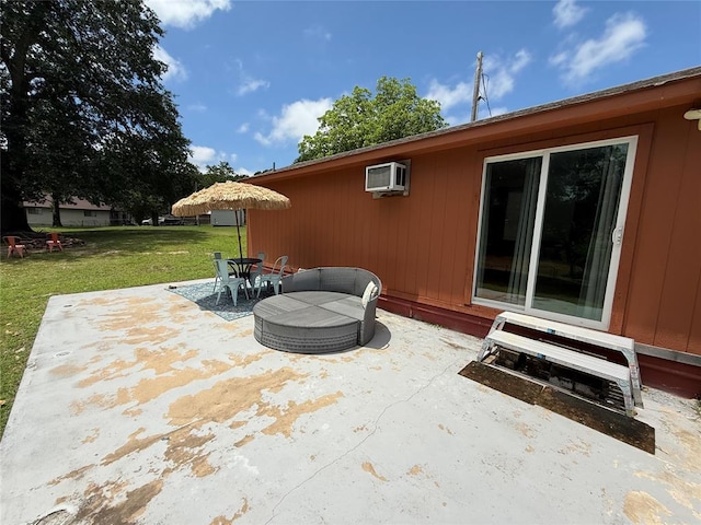 410052 E 1103rd Rd, Checotah, OK 74426 - view of patio with a wall unit AC and outdoor dining space