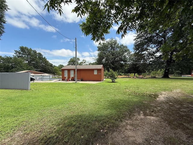 410052 E 1103rd Rd, Checotah, OK 74426 - view of yard featuring an outdoor structure and a patio