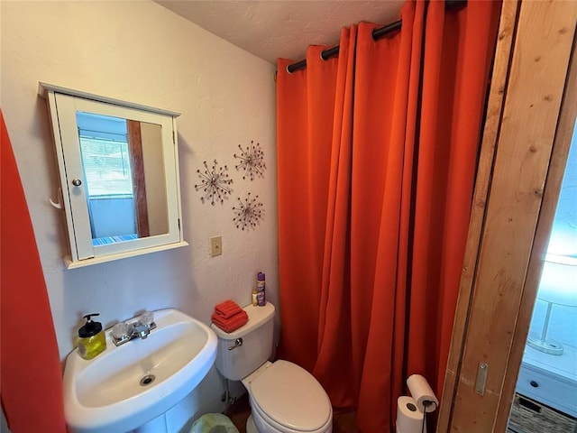 410052 E 1103rd Rd, Checotah, OK 74426 - bathroom featuring a sink and toilet
