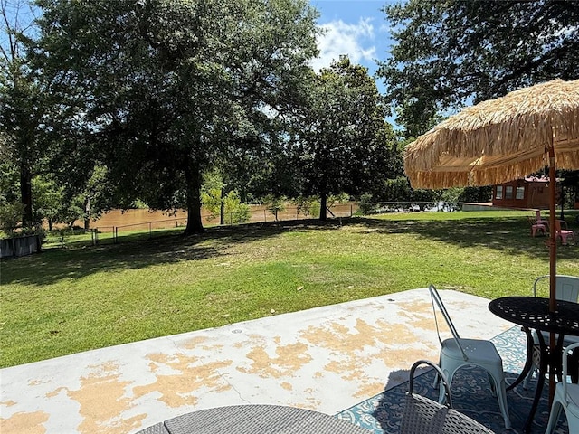 410052 E 1103rd Rd, Checotah, OK 74426 - fenced backyard featuring a patio