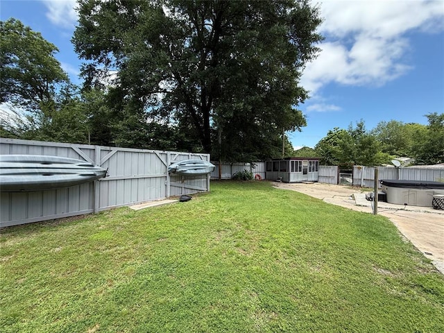 410052 E 1103rd Rd, Checotah, OK 74426 - fenced backyard featuring a hot tub and a patio area