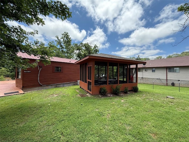 410052 E 1103rd Rd, Checotah, OK 74426 - back of house with a sunroom, a deck, and a metal roof