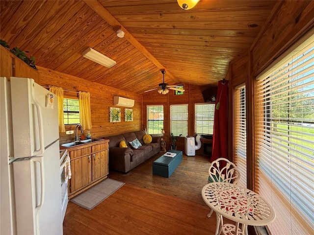410052 E 1103rd Rd, Checotah, OK 74426 - living area with light wood-style floors, a ceiling fan, wood walls, wood ceiling, and lofted ceiling