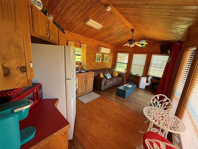 410052 E 1103rd Rd, Checotah, OK 74426 - living area featuring wood-type flooring, a ceiling fan, wooden ceiling, and wood walls