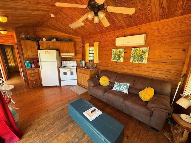 410052 E 1103rd Rd, Checotah, OK 74426 - living area with wood ceiling, wood walls, an AC wall unit, wood finished floors, and a ceiling fan