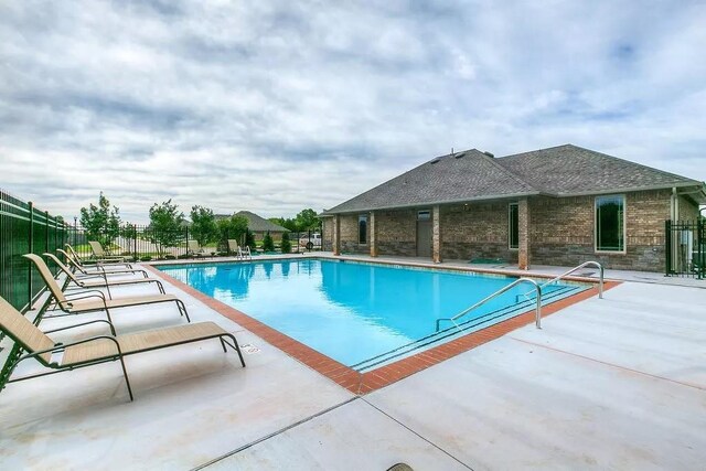 9205 SW 45th Ter, Oklahoma City, OK 73179 - community pool featuring a patio