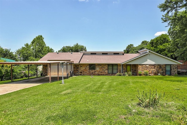 11129 E Thayer St, Midwest City, OK 73130 - back of house with a carport, driveway, a lawn, and stone siding