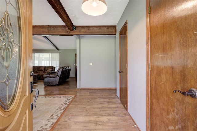 11129 E Thayer St, Midwest City, OK 73130 - entrance foyer featuring beam ceiling and light wood-style floors