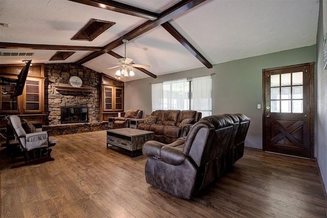11129 E Thayer St, Midwest City, OK 73130 - living area with wood finished floors, plenty of natural light, ceiling fan, and a stone fireplace