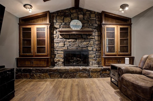 11129 E Thayer St, Midwest City, OK 73130 - living area featuring wood finished floors and a fireplace