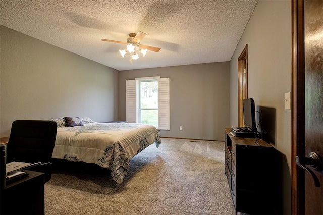 11129 E Thayer St, Midwest City, OK 73130 - bedroom featuring carpet floors, a textured ceiling, and ceiling fan