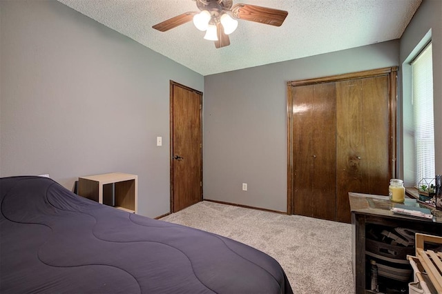 11129 E Thayer St, Midwest City, OK 73130 - bedroom featuring carpet, a textured ceiling, multiple windows, and a ceiling fan