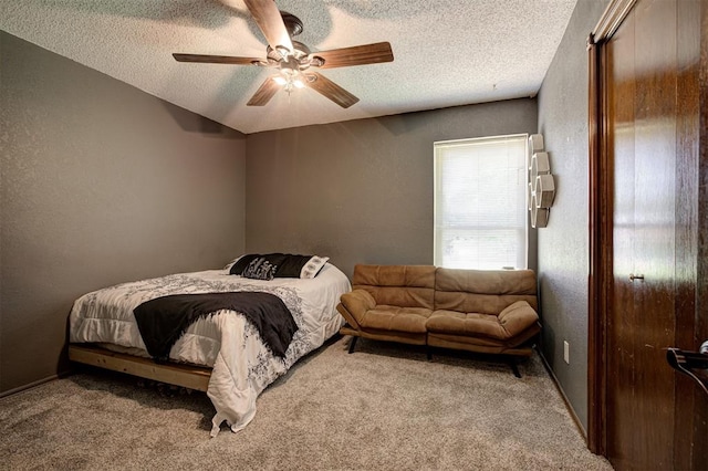 11129 E Thayer St, Midwest City, OK 73130 - bedroom with a textured ceiling, carpet flooring, a ceiling fan, and a textured wall