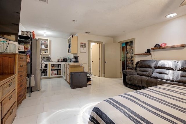 11129 E Thayer St, Midwest City, OK 73130 - bedroom with freestanding refrigerator